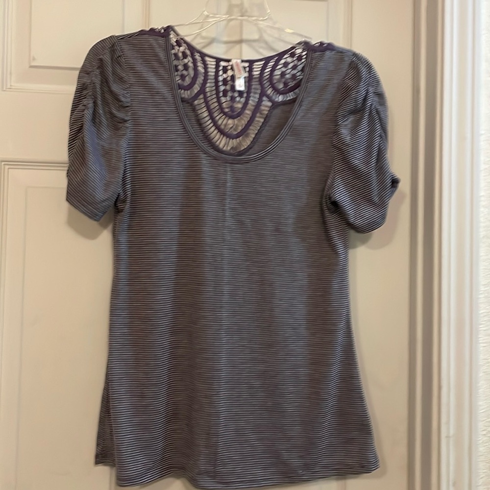 Adorable blouse with detailed sleeves and back design